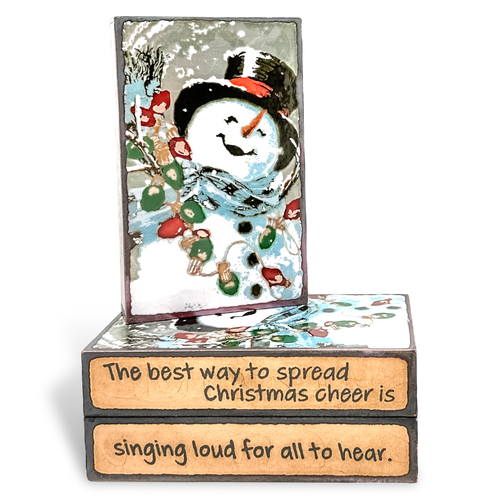 Houston Llew Spiritile #290 ‘Frosty’ – Glass-on-copper art tile featuring a snowman with a red scarf, perfect for holiday decor and collector gifts.