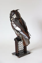 Load image into Gallery viewer, Handcrafted metal great horned owl sculpture by David Groenjes made from reclaimed steel, gears, and chains, perched on an industrial base with a piercing gaze.