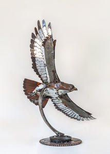 "The Red Baron" reclaimed metal sculpture by David Groenjes, industrial artwork crafted from salvaged steel and mechanical parts, aviation-inspired contemporary sculpture.