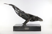 Load image into Gallery viewer, Handcrafted metal whale sculpture by David Groenjes made from reclaimed steel and mechanical components, mounted on an industrial base against a clean white background.