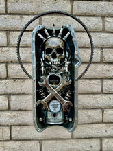 Load image into Gallery viewer, &quot;Dead Pan&quot; reclaimed metal wall sculpture by Paul Klaine, 25-inch artwork featuring skull, crossed wrenches, spark plugs, gears, and oil pressure gauge in steel frame.