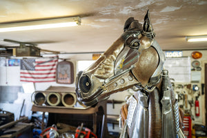 Side view of Dirty Dick, a life-sized mechanical horse sculpture with a hidden drink dispenser, perfect for Western, industrial, and luxury decor.