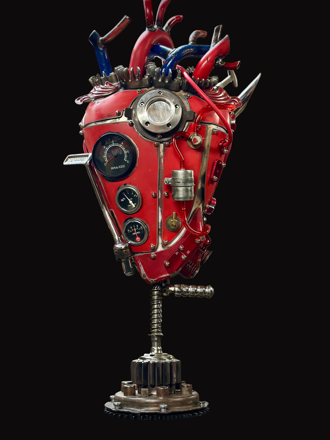 “Kick Start My Heart steampunk metal sculpture by Paul Klaine, reclaimed steel anatomical heart with gauges, gears, and industrial detailing.”