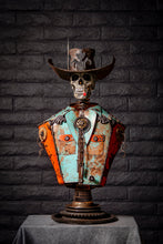 Load image into Gallery viewer, &quot;Let’s Get Western&quot; reclaimed metal sculpture by Paul Klaine, skeletal cowboy bust with wide-brimmed hat, bolo tie, turquoise and orange steel shirt, mounted on gear pedestal.