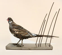 Load image into Gallery viewer, &quot;Losing Ground&quot; – Metal pheasant sculpture by artist David Groenjes, crafted from reclaimed steel and found objects, displayed in an outdoor natural setting