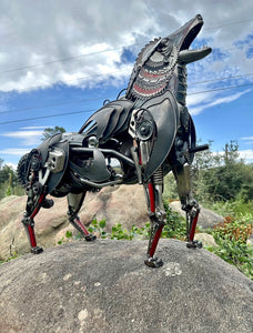 Howler Deluxe – A handcrafted steampunk metal coyote sculpture by Paul Klaine, featuring industrial gears and mechanical detailing, perfect for wildlife and steampunk decor.