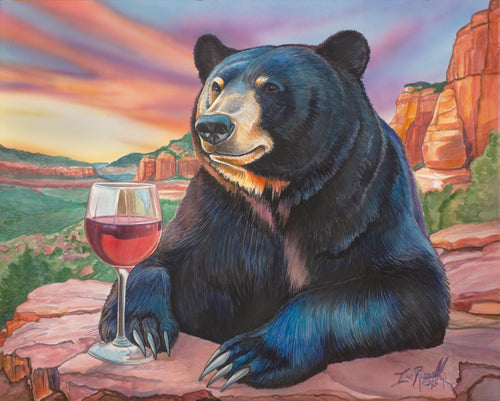 “Red Rocks and Red Wine” watercolor painting by Ian Russell featuring a black bear holding a glass of red wine with Sedona red rock cliffs at sunset, original whimsical Southwest art.