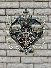 Load image into Gallery viewer, &quot;Sprung on You&quot; reclaimed metal wall sculpture by Paul Klaine, 25-inch heart-shaped artwork with opposing skulls, gears, and ornate steel scrollwork.