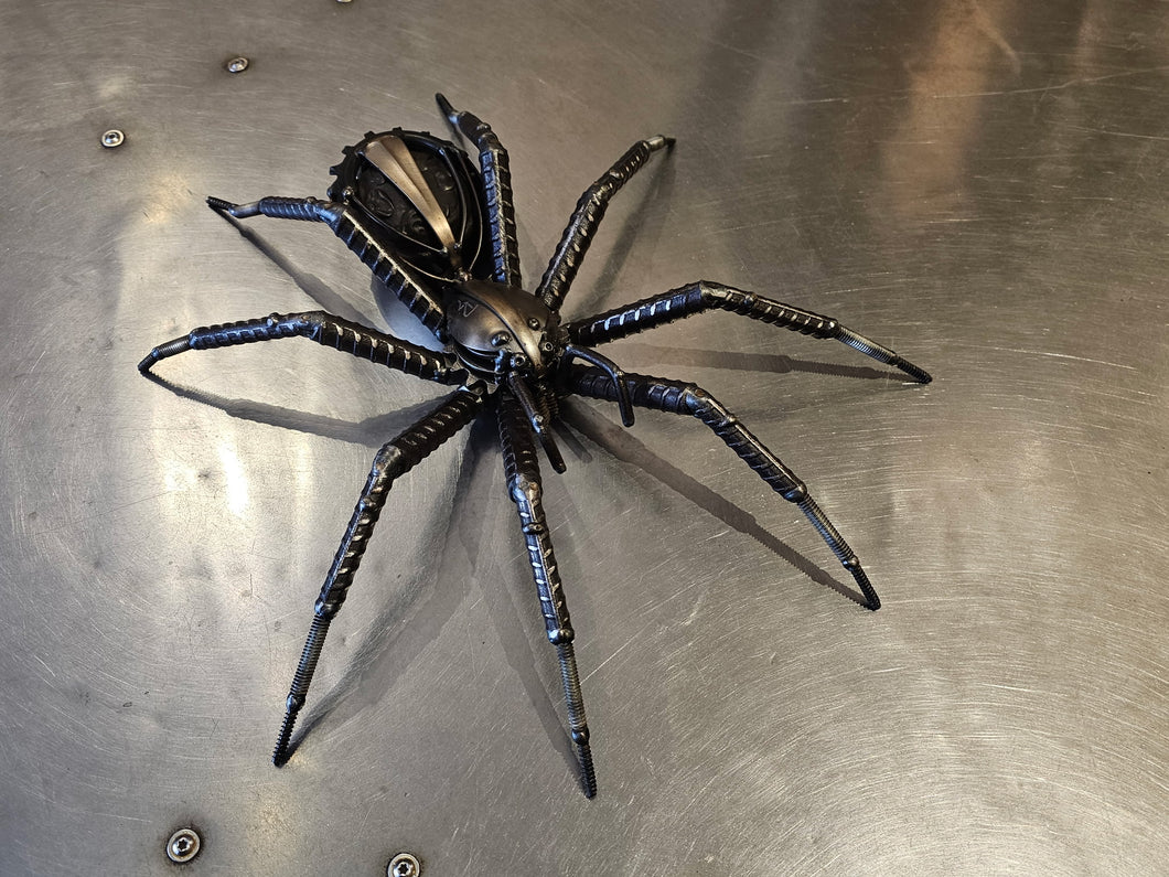 “Wolf Spider” by David Groenjes — a reclaimed steel sculpture capturing the intricate beauty and power of nature. Original wildlife metal art from Prescott, Arizona.