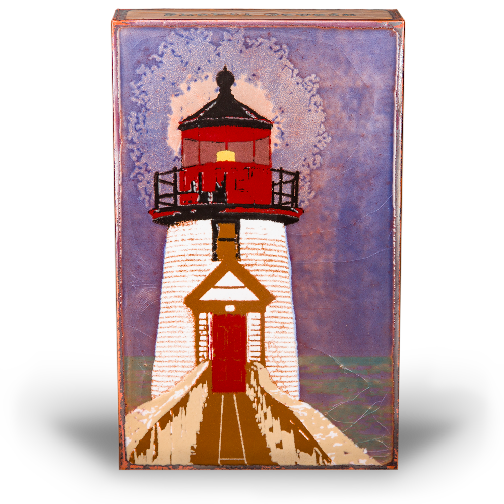 Houston Llew Spiritile #239 ‘Beacon’ – Glass-on-copper art tile featuring a lighthouse standing tall against a sunset sky, perfect for nautical decor and coastal home accents