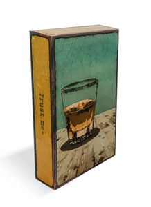 Houston Llew Spiritile #247 ‘Liquid Courage’ displayed as home bar decor – A handcrafted glass enamel tile featuring a whiskey bottle and glass, ideal for collectors and bourbon enthusiasts.