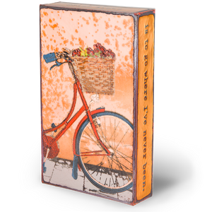 Houston Llew Spiritile #274 ‘Fresh Ride’ displayed as home decor – A handcrafted glass enamel tile featuring a vintage bicycle, perfect for cycling enthusiasts and adventurers.